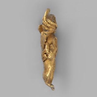 Eros-shaped pendant, Pendant in the shape of a standing Cupid with simplified hands; facial