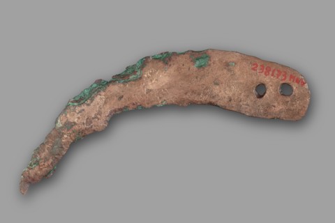 Sickle blade, unknown Northern Mesopotamian workshop. The sickle blade is arched, tipped with a