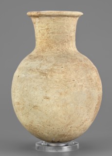 Flask, unknown Northern Mesopotamian workshop. Clay flask-shaped vessel with an elongated ovoid