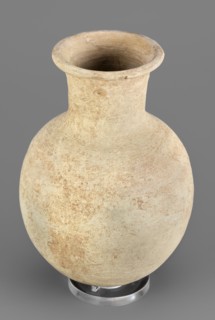 Flask, unknown Northern Mesopotamian workshop. Clay flask-shaped vessel with an elongated ovoid