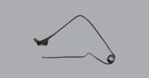 Fibula, Bronze Etruscan fibula with a bent ring made of flatly beaten wire, passing in a three-turn