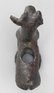 Emblem in the form of a figurine of a standing goat figurine of a standing gazelle with slightly