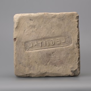 Hypocaust brick with stamp impression, square. From a hypocaust post. Negative stamp, 2nd half of