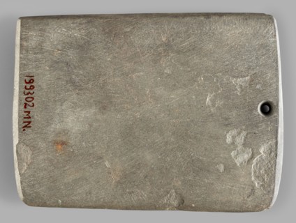 Rectangular paddle, flat with a hole at one of the shorter edges; possibly a whetstone.