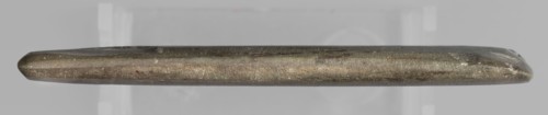 Rectangular paddle with a hole at one of the shorter edges; possibly a whetstone. Flat rectangular