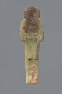 Ushabti ?-en-Khonsu, Mummy-shaped figurine shabti. Arms crossed on the chest, right folded over