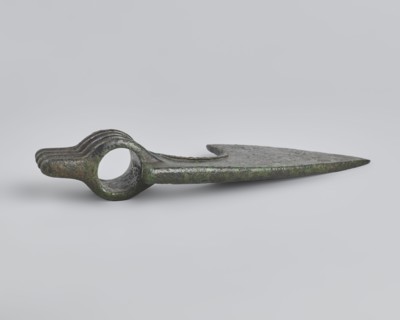Battle axe, unknown Luristan workshop. Battle axe with a low cylindrical socket with a round hole,