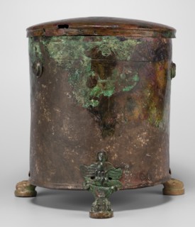 Cista container decorated with a depiction of the Dioscuri and Athena. Cylindrical sheet-metal