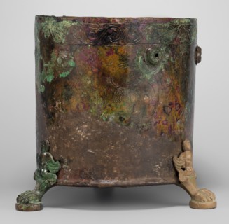 Cista container decorated with a depiction of the Dioscuri and Athena. Cylindrical vessel made of