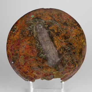 Cista container decorated with a depiction of the Dioscuri and Athena. Cylindrical vessel made of