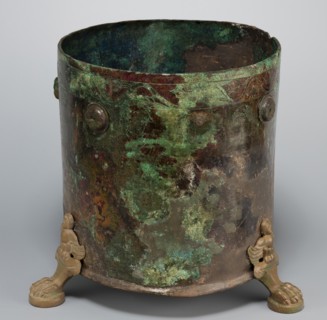 Cista container decorated with a depiction of the Dioscuri and Athena. Cylindrical vessel made of