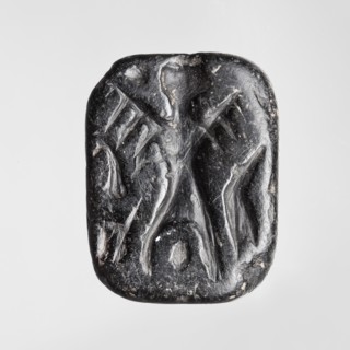 Rectangular stamp seal with a handle in the form of a protruding ridge along the axis of the seal