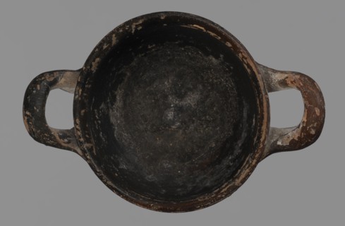 Miniature skyphos. Reddish clay, black-brown firnis poorly covering the outside on the foot, at the