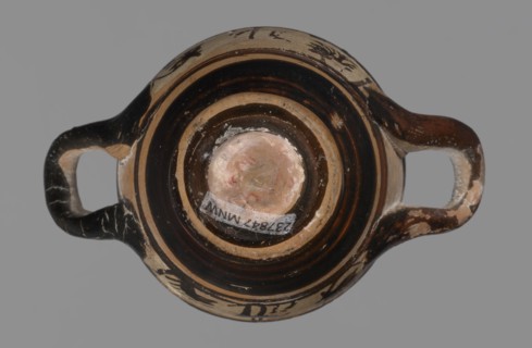 Miniature skyphos. Reddish clay, black-brown firnis poorly covering the outside on the foot, at the