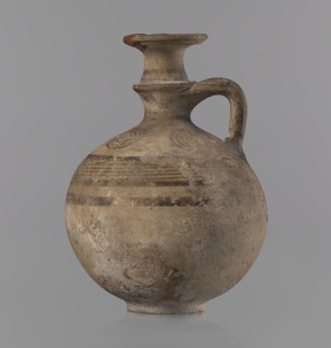 Jug with a flat foot, spherical body, high narrow neck with a strongly tilted spout and a small