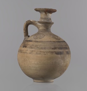 Cypriot jug, Jug with a flat foot, spherical body, high narrow neck with a strongly tilted spout,