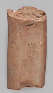 Fragment of a transport amphora vice with a stamp depicting an oinochoe and an incomplete Greek