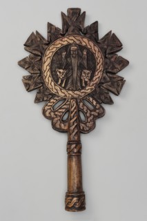 Processional cross, Ethiopian workshop. In the center of the cross, in the tondo, a standing man is