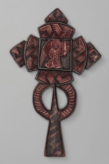 Processional cross, Ethiopian workshop. At the intersection of the cross's arms is a square