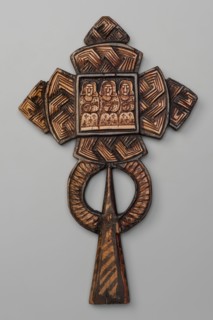 Processional cross, Ethiopian workshop. At the intersection of the cross's arms is a square