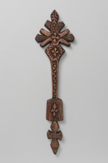 Hand cross, Ethiopian workshop. The upper part, inscribed in a rhombus, is mounted on a long shaft
