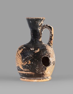 Lekythos with a sphinx, unknown Attic workshop. A small Attic red-figure lekythos with a spout. The