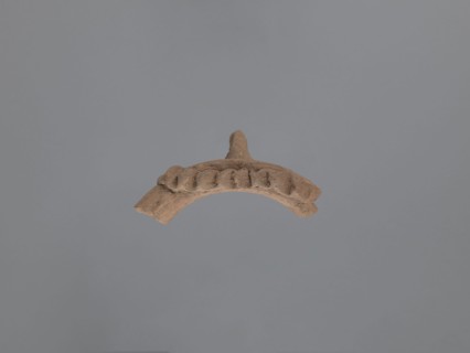 Fragment of a vessel with applied decoration, Coptic pottery, plastic decoration. Fragment of the