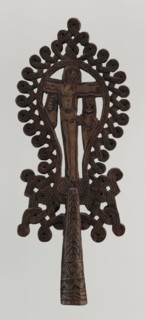 Processional cross, Ethiopian workshop. The pear-shaped frame depicts Christ on the cross with John