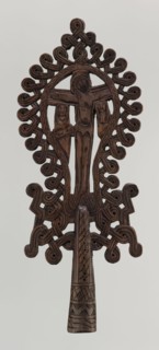 Processional cross, Ethiopian workshop. The pear-shaped frame depicts Christ on the cross with John