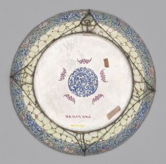 Platter, Large decorative platter with flat bottom and edges rising in an arc, set on a low, wide