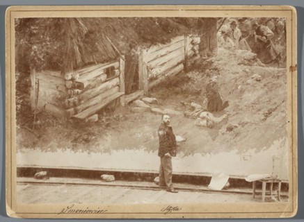 Painting the Raclawice Panorama: Jan Styka standing with a palette next to a part of the canvas