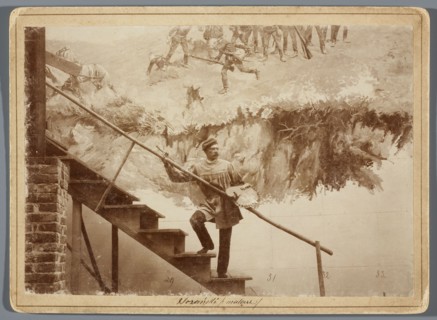 Michal Sozanski standing with a palette on a scaffolding next to a part of the canvas depicting the