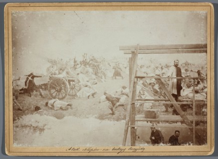 Painting the Raclawice Panorama: Jan Styka standing on scaffolding by a section of the canvas