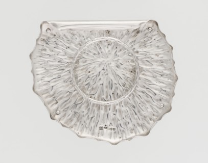 Jam or honey container stand in the shape of a stylized leaf, rolled up on one side, with wavy