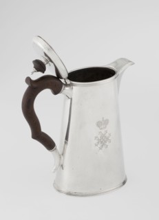 Conical coffee pot with hinged lid, slightly arched and flattened at the top, topped with a wooden