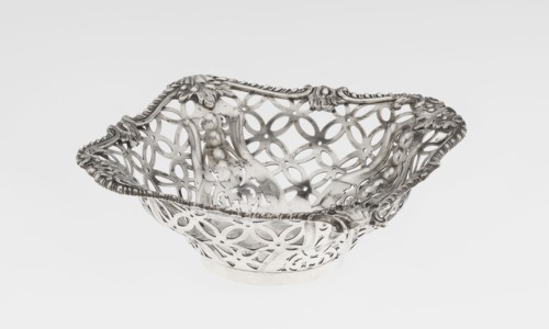 Openwork basket by Comyns & Sons goldsmiths’ firm, active 1859–1953. Four-sided openwork basket on