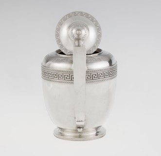 Teapot, maker: John Emes fl. 1796–1808. Ovoid silver teapot on a circular base with lid;