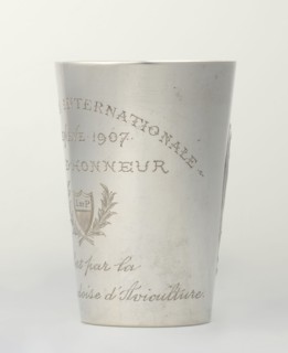 Art Nouveau conical mug with relief ornament of lily-of-the-valley flowers and engraved inscription