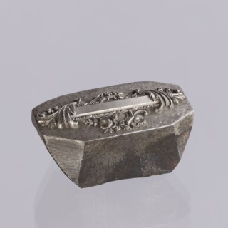 Jewellery die, Approximately hexagonal die with a relief rectangular reserve enclosed at the ends