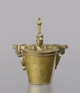 Seven weights in the form of bowls—truncated cones; the eighth, largest, serves as a container for