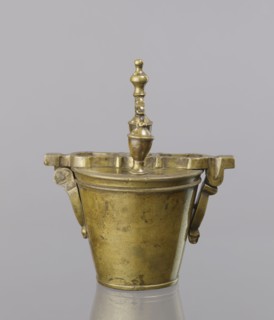Seven weights in the form of bowls — truncated cones; the eighth largest serves as a container for