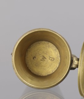 Seven weights in the form of bowls — truncated cones; the eighth, largest, serves as a container