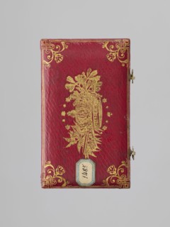 Rectangular key case with a hinged lid and two clasp hooks. Trimmed with red leather, with gilded