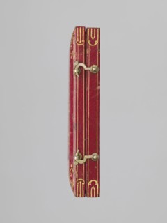 Rectangular key case with a hinged lid and two clasp hooks. Trimmed with red leather, with gilded