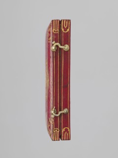 Rectangular key case with a hinged cover and two clasp hooks. Trimmed with red leather, with gilded