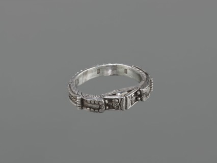 Bracelet, maker, scrap metal; 19th century, China/Mongolia; dragon with pearl motif;