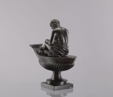 Decorative cast iron oil lamp, 19th century, Poland; square plinth with an oval boat-shaped
