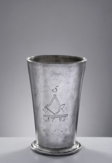 Bricklayers' guild mug. Tin mug of conical shape, set on a profiled convex base with a turned-down