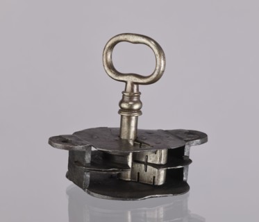 Register lock with key, locksmithing. Register on the bottom plate in the form of an irregular