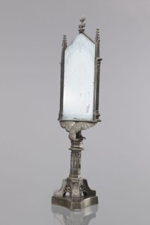 Candle screen. On a three-sided plinth, on a tripod decorated with oak branches, with a hexagonal